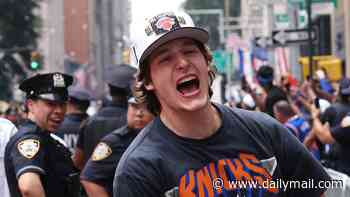Shocking moment Knicks star is manhandled by NYPD after being mistaken for a fan during parade celebrations