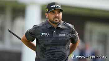 Day carted off course, exits Open with back injury...