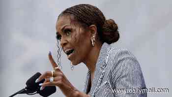 Michelle Obama dispels her rocky marriage rumors as she sings husband Barack's praises... but one eyebrow raising comment suggests it's not all plain sailing