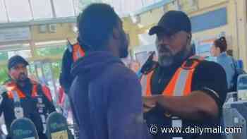 At last! Ticket inspectors finally get tough on fare dodgers: Moment hero TfL worker pushes man back into station as he tries to force his way out without paying