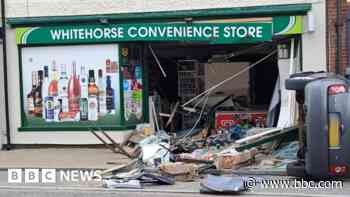 Cash machine ripped out of town store