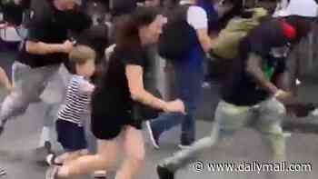 Tourists run for their lives as gunfire erupts in New York's Times Square as terrified parents drag children to safety