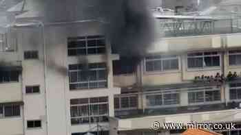 Tokyo primary school fire sees children stranded on second-floor window ledge