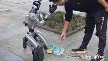 Humanoid robot is spotted BEGGING on a street in China - claiming it has 'no money to recharge'