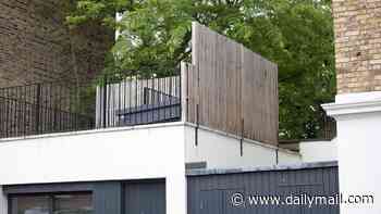 Notting Hill £1.2m house owner wins two-year £10,000 planning battle with council over wooden screen he erected to stop neighbours overlooking his roof terrace