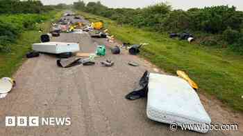 Mattresses and rubbish dumped across rural road