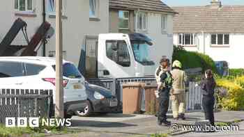 Four men arrested after skip lorry crashed into house