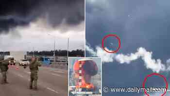 Was huge Moscow oil depot explosion caused by RUSSIAN missile strike? New footage shows Putin troops opening fire in middle of road and a possible misfire hit refinery
