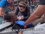 Revealed: Hero, 24, who saved man's LIFE in dramatic rescue during New York Knicks victory parade after defying cops' orders: 'I'm just another New Yorker'