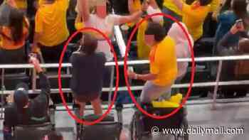 It's a miracle! Colombian fans are caught leaping out of their wheelchairs to celebrate a goal while seated in disabled zone