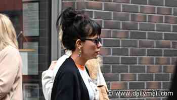 Lily Allen steps out in red leather hotpants for lunch date with her friends ahead of her sold-out show in Manchester