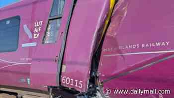 Two trains collide near Bedford: Serious injuries feared after Luton Airport Express 'collides with stationary train' as casualties covered in blood are seen disembarking from carriage