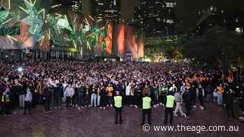 Fans storm Fed Square barriers as flares go off at World Cup live site