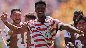 United States into World Cup knockout round after blanking Australia