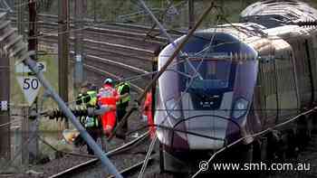 Two trains collide north of London, killing at least 1 person and injuring dozens