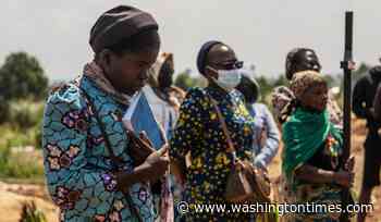 Mourners bury a 6-month-old Ebola victim in the Congo outbreak's 3rd orphanage death
