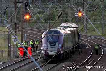 Train driver killed and dozens injured as two trains collide near Bedford