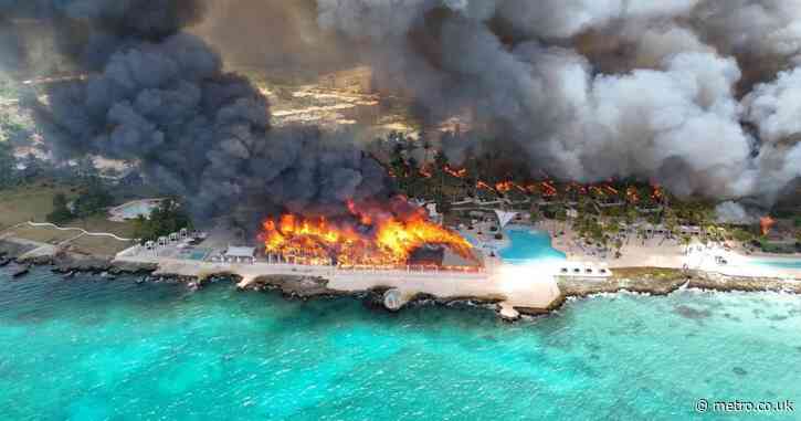 At least one dead and 1,700 evacuated after fire at luxury beach resort