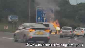 Firefighters descend on M62 junction after van bursts into flames