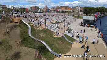 Visitors flock to the play areas and amphitheatre of Stockton's newly opened Waterfront Urban Park