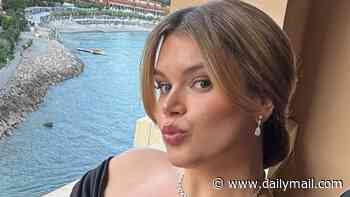 Grace Kelly's lookalike granddaughter, 27, wows in bikini snaps...as she packs on the PDA during beach getaway