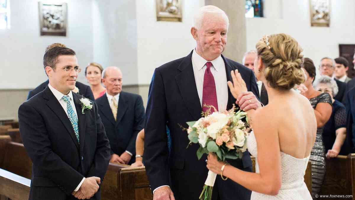 Bride is walked down wedding aisle by man who received her late father's heart