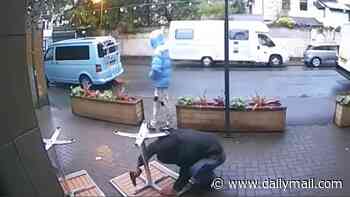 Table for two: Moment thieves are caught on CCTV taking drills to pub to steal outside furniture