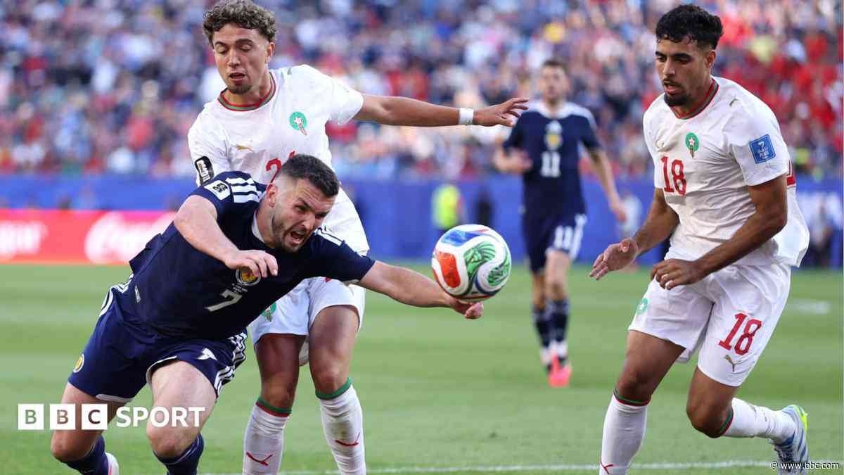 Referee told McGinn penalty denied as ball going out of play