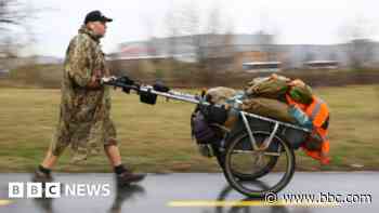 Who is Karl Bushby and why is he walking around the world?