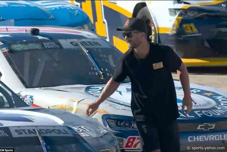 Fan arrested after scaling fences onto NASCAR track, fist-bumping driver during stoppage
