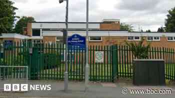 Primary school closes after man seen carrying brick