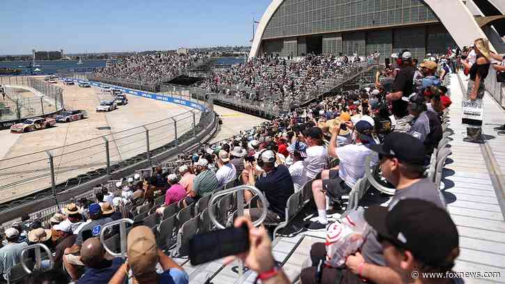 Fan hops fence during red-flagged NASCAR race at San Diego's Naval Base Coronado to meet a driver