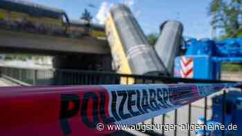 Wie konnte der Zug in München von der Brücke stürzen und wie liefen die Bergungsarbeiten ab?