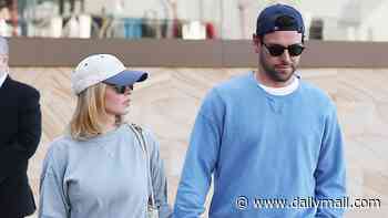 Sydney Sweeney jumps into Scooter Braun's arms as the couple pack on the PDA during Sydney stroll