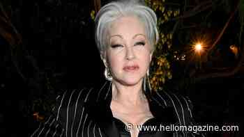 Cyndi Lauper, 72, commands attention in the Bahamas in corset mini dress and knee-high socks