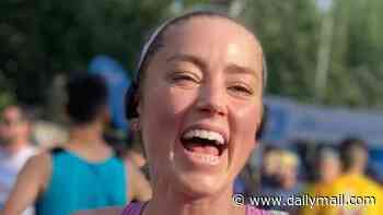 Johnny Depp's ex Amber Heard gives rare glimpse of daughter Oonagh, five, after finishing 10k race in Spain