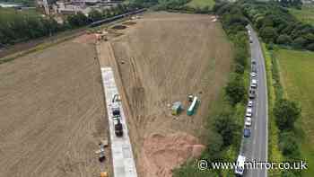 Bedford train crash 'complex' recovery underway as 'temporary road' built beside track