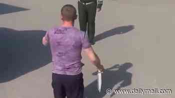 Putin 'prepares mass call-up' for the Ukraine meat-grinder - as video shows Russian veteran with no legs threatening recruiter with a knife in sign of growing resistance facing desperate Kremlin