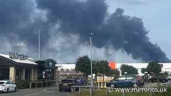 Huge fire at Widnes warehouse sends black smoke billowing into the sky