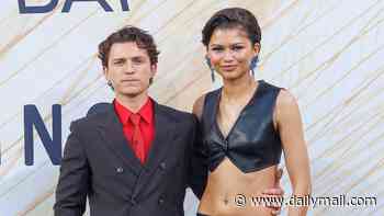 Zendaya flashes her abs in a black leather co-ord as she towers over husband Tom Holland at a Spider-Man fan event in Berlin after confirming their secret wedding