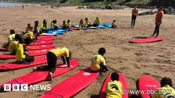 Kids from the city get first taste of surfing