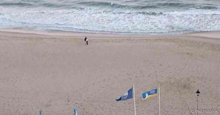 Mother ‘swimming with her son’ dies after being pulled from sea