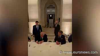 Moment Trump signs US-Iran deal at Palace of Versailles