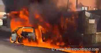 Cars catch fire and man injured after men 'fighting with weapons' in Glasgow