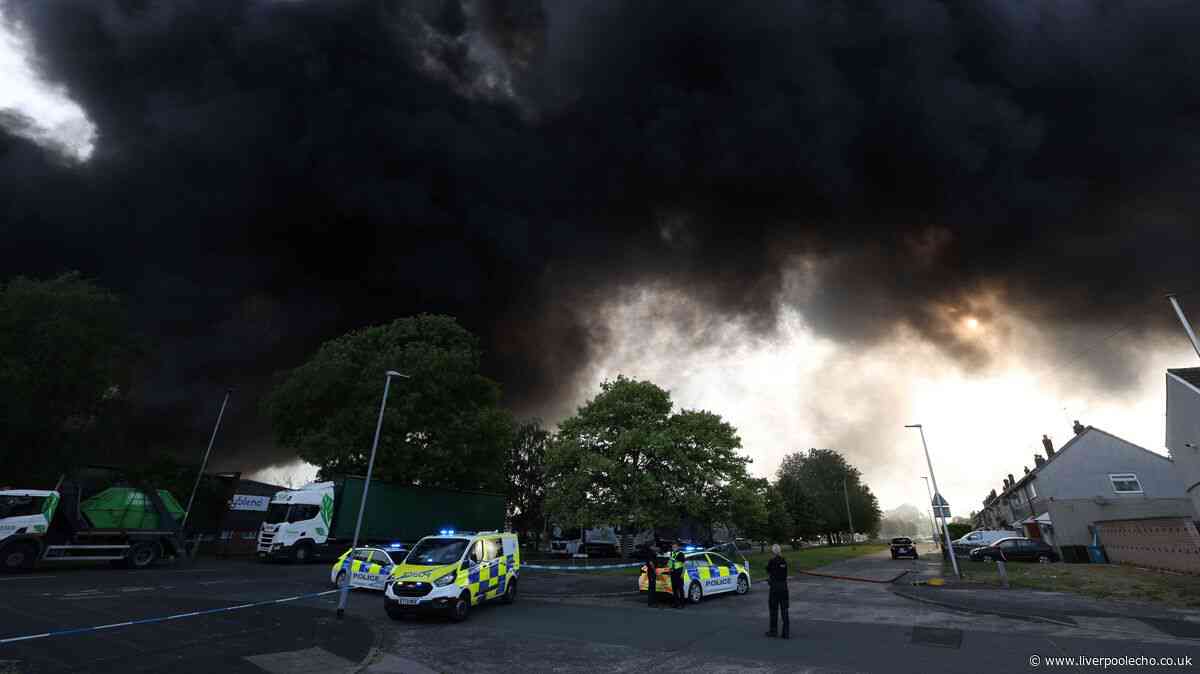 Ash rains down on homes as huge fire tears through Widnes warehouse
