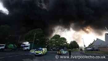 Ash rains down on homes as huge fire tears through Widnes warehouse