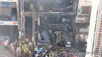 Huge building fire in India leaves 'at least' 14 people dead as people clamber to escape