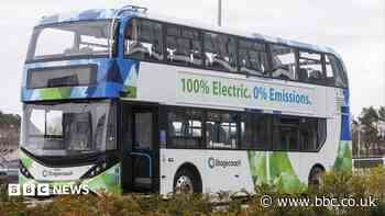 Electric buses being charged by diesel generator