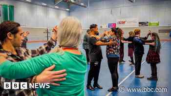 Blind students learning ballroom dancing