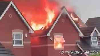 Moment massive flames ravage family home after being struck by lightning during thunderstorm